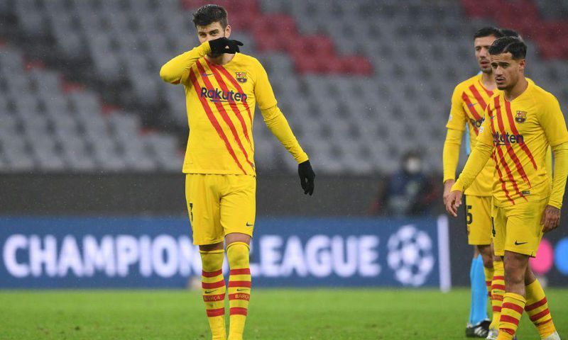Gerard Pique (L) and Philippe Coutinho at the end of Barcelona's 3-0 defeat at the hands of Bayern Munich that sent them packing from the Champions League