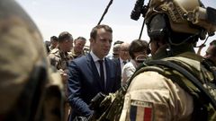 France is attempting to overcome US reservations about financial backing for anti-terrorism forces in the Sahel region of Africa, pictured in May 2017 when French President Emmanuel Macron (C), visited the French troops in northern Mali