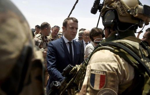 France is attempting to overcome US reservations about financial backing for anti-terrorism forces in the Sahel region of Africa, pictured in May 2017 when French President Emmanuel Macron (C), visited the French troops in northern Mali