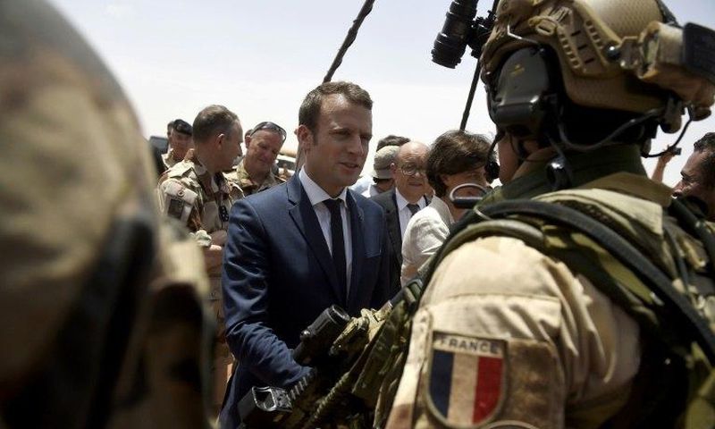 France is attempting to overcome US reservations about financial backing for anti-terrorism forces in the Sahel region of Africa, pictured in May 2017 when French President Emmanuel Macron (C), visited the French troops in northern Mali