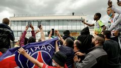 Expectant PSG supporters gather at Le Bourget airport just outside Paris on Monday, waiting for the possible arrival of Lionel Messi