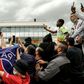 Expectant PSG supporters gather at Le Bourget airport just outside Paris on Monday, waiting for the possible arrival of Lionel Messi