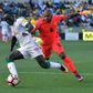 South Africa goalkeeper Itumeleng Khune (R) chases Senegal star Sadio Mane during a 2018 World Cup qualifer.