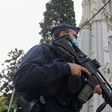 A police officer stands near Notre Dame church, where a knife attack took place, in Nice, France.