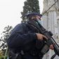 A police officer stands near Notre Dame church, where a knife attack took place, in Nice, France.
