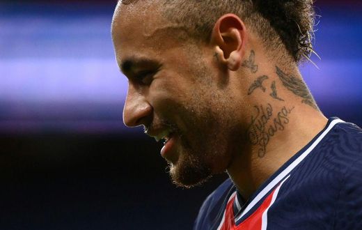 All smiles: Paris Saint-Germain's Neymar reacts after scoring on Sunday