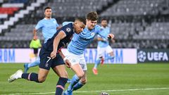 John Stones (right) helped keep PSG star duo Kylian Mbappe (left) and Neymar quiet