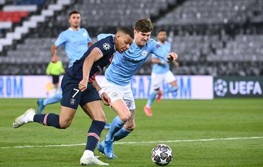 John Stones (right) helped keep PSG star duo Kylian Mbappe (left) and Neymar quiet