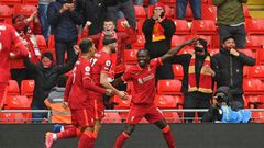 Pointing towards the Champions League: Sadio Mane (right)scored the goals that secured Liverpool a top-four finish