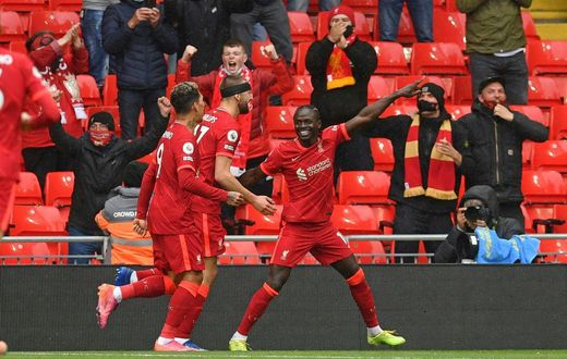 Pointing towards the Champions League: Sadio Mane (right)scored the goals that secured Liverpool a top-four finish