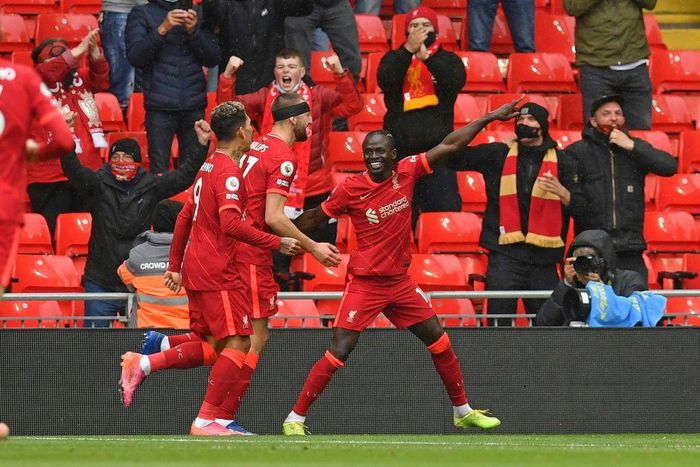 Pointing towards the Champions League: Sadio Mane (right)scored the goals that secured Liverpool a top-four finish