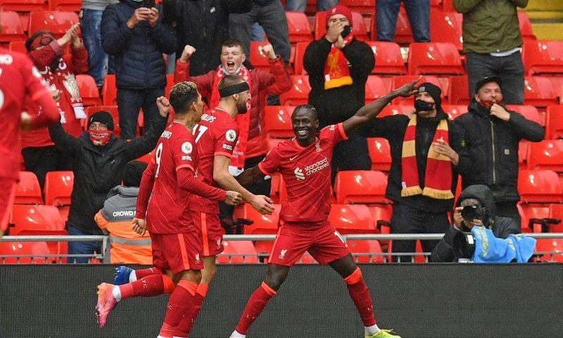 Pointing towards the Champions League: Sadio Mane (right)scored the goals that secured Liverpool a top-four finish