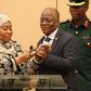 Tanzania's Vice President Samia Hassan Suluhu and President John Magufuli taking a call together in July 2019.