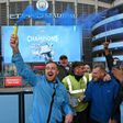 Manchester City fans celebrate winning the Premier League title
