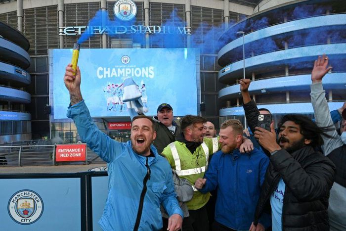 Manchester City fans celebrate winning the Premier League title