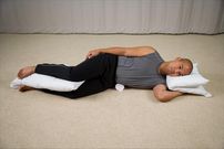 Sleep on your side with a pillow between your knees [MyDoctorOnline]