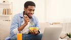 You shouldn't eat while watching a movie [iStock]