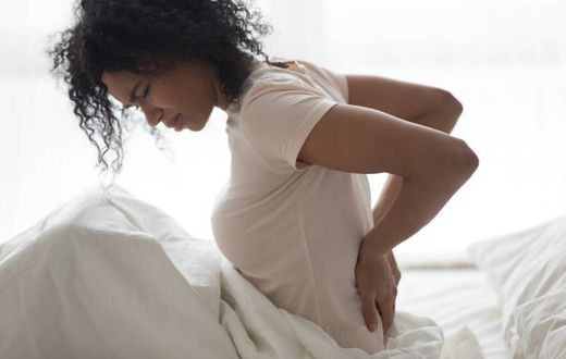 What are the best sleeping positions for reducing back pain? [iStock]