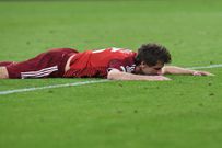 Thomas Muller looks down in disappointment after Bayern Munich were eliminated from the UCL by Villareal