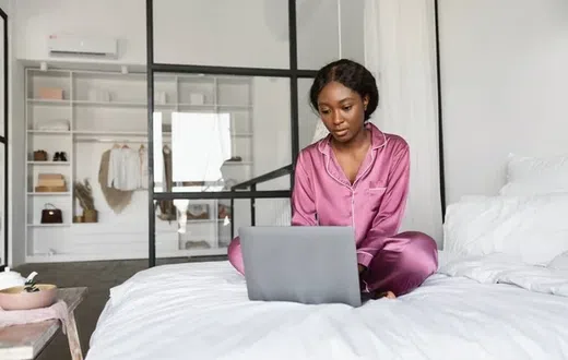 Dangers of using your laptop in bed [Depositphotos]