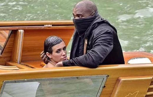Kanye West, 46, (right) and his Australian 'wife' Bianca Censori, 28, (left) have been banned for life by a Venetian boat rental company following their indecent exposure scandal in Italy last Monday