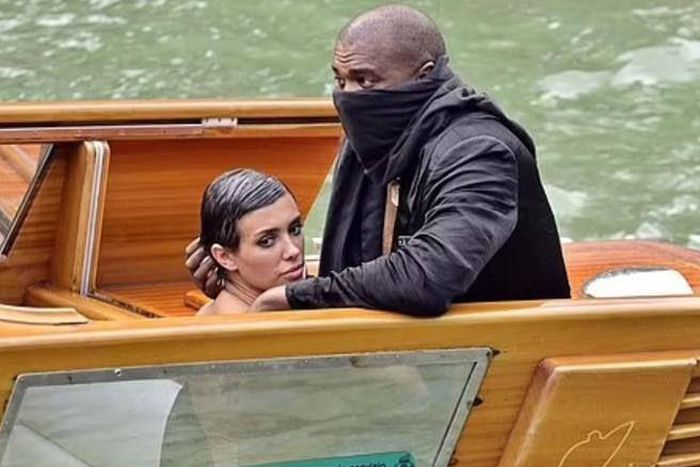 Kanye West, 46, (right) and his Australian 'wife' Bianca Censori, 28, (left) have been banned for life by a Venetian boat rental company following their indecent exposure scandal in Italy last Monday