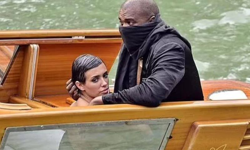 Kanye West, 46, (right) and his Australian 'wife' Bianca Censori, 28, (left) have been banned for life by a Venetian boat rental company following their indecent exposure scandal in Italy last Monday
