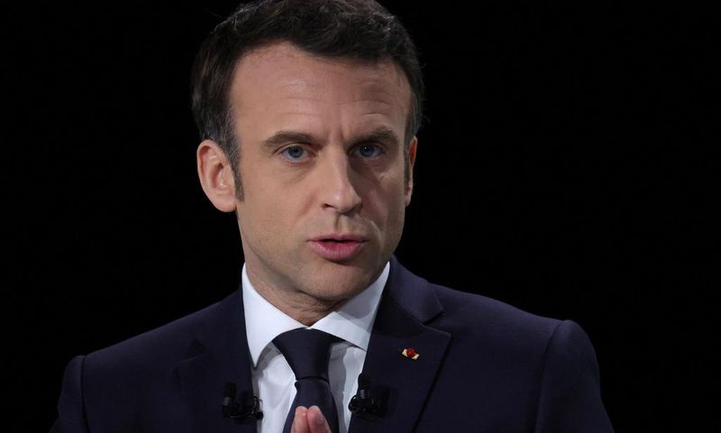 French President Emmanuel Macron, candidate for his re-election in the 2022 French presidential election, gestures as he speaks during a news conference to unveil his presidential program at Les Docks de Paris, in Aubervilliers near Paris, France, Marc...