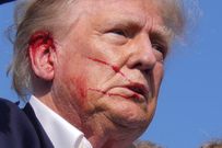 Former President Donald Trump was escorted off-stage with blood on his face after an assassination attempt in Pennsylvania.Evan Vucci