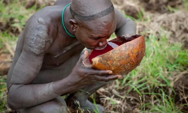 A suri warrior drinking blood [TheSun/Exclusivepix]