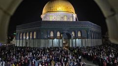 Palestinian devotees pray on Laylat al-Qadr (Night of Destiny) outside the Dome of the Rock in Jerusalem's Al-Aqsa Mosque compound during the Muslim holy month of Ramadan on May 8, 2021