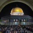 Palestinian devotees pray on Laylat al-Qadr (Night of Destiny) outside the Dome of the Rock in Jerusalem's Al-Aqsa Mosque compound during the Muslim holy month of Ramadan on May 8, 2021