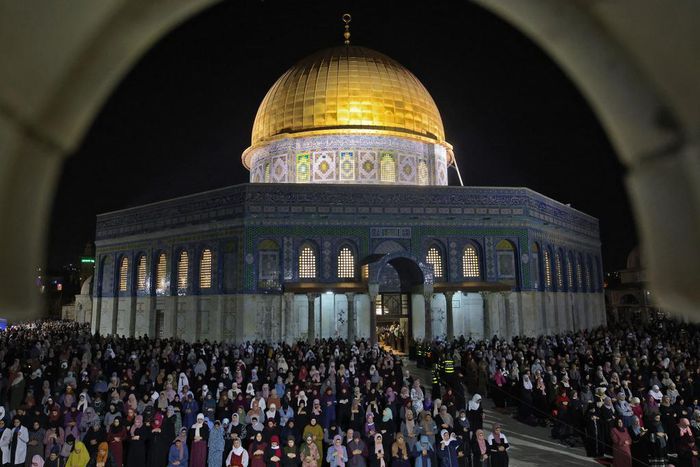Palestinian devotees pray on Laylat al-Qadr (Night of Destiny) outside the Dome of the Rock in Jerusalem's Al-Aqsa Mosque compound during the Muslim holy month of Ramadan on May 8, 2021