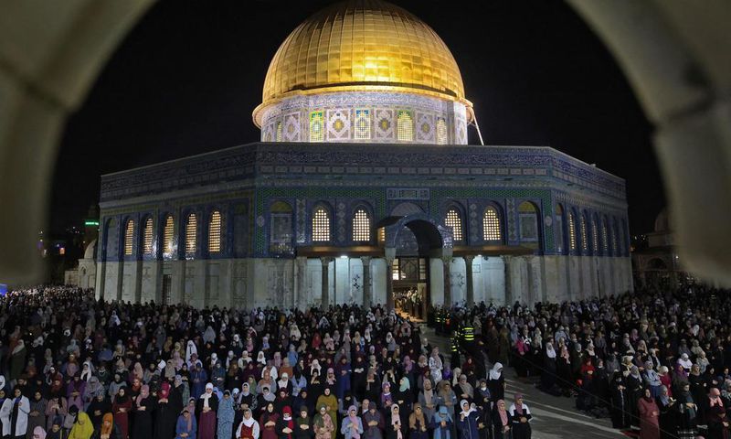 Palestinian devotees pray on Laylat al-Qadr (Night of Destiny) outside the Dome of the Rock in Jerusalem's Al-Aqsa Mosque compound during the Muslim holy month of Ramadan on May 8, 2021
