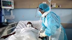 A health personnel attends to a Covid-19-patient