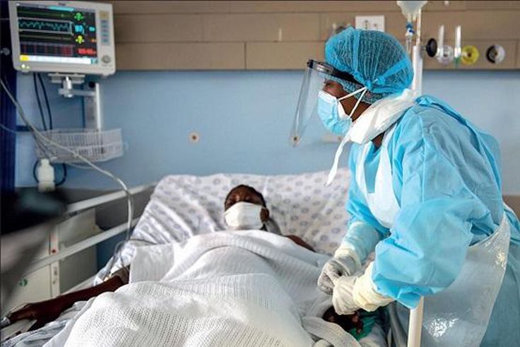 A health personnel attends to a Covid-19-patient