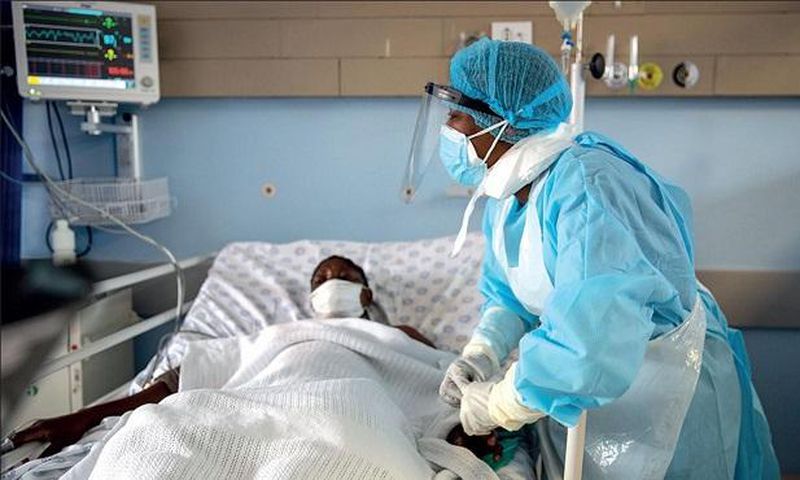 A health personnel attends to a Covid-19-patient