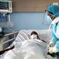 A health personnel attends to a Covid-19-patient