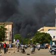 Smoke rises from the Burkinabe capital Ouagadougou from a jihadist attack in March 2018. Eight soldiers and eight assailants died, according to an official toll