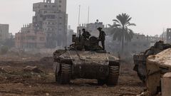 This picture taken during a media tour organized by the Israeli military on Jan. 8, 2024, shows troops operating in the area of al-Bureij in the central Gaza Strip.Photo by MENAHEM KAHANA/AFP via Getty Images