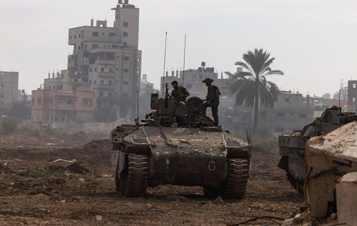This picture taken during a media tour organized by the Israeli military on Jan. 8, 2024, shows troops operating in the area of al-Bureij in the central Gaza Strip.Photo by MENAHEM KAHANA/AFP via Getty Images