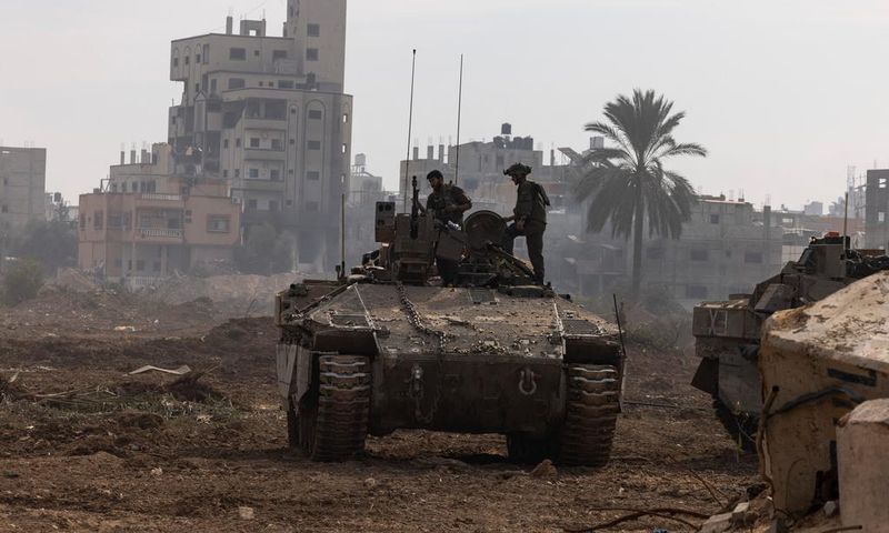 This picture taken during a media tour organized by the Israeli military on Jan. 8, 2024, shows troops operating in the area of al-Bureij in the central Gaza Strip.Photo by MENAHEM KAHANA/AFP via Getty Images