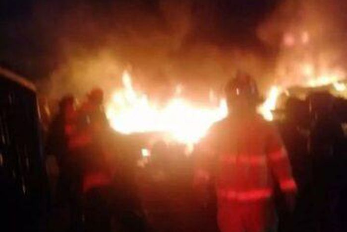 Firemen putting out the flames