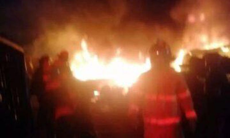 Firemen putting out the flames