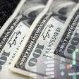 Cash dollars and stock market indicators (inflation, economy, crisis, finance)Getty Images