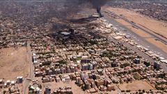 This image taken from AFPTV video footage on April 20, 2023, shows black smoke rising above the Khartoum International Airport amid ongoing fighting in Sudan.AFP via Getty Images
