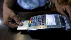 Swiping a credit cardREUTERS/Dinuka Liyanawatte