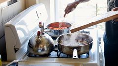 A man cooking in a kitchen.Granger Wootz/Getty Images