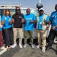 Aliou Cissé pose avec des membres de l'UNICEF