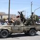 Sudanese greet army soldiers, loyal to army chief Abdel Fattah al-Burhan, in the Red Sea city of Port Sudan on April 16, 2023.AFP via Getty Images